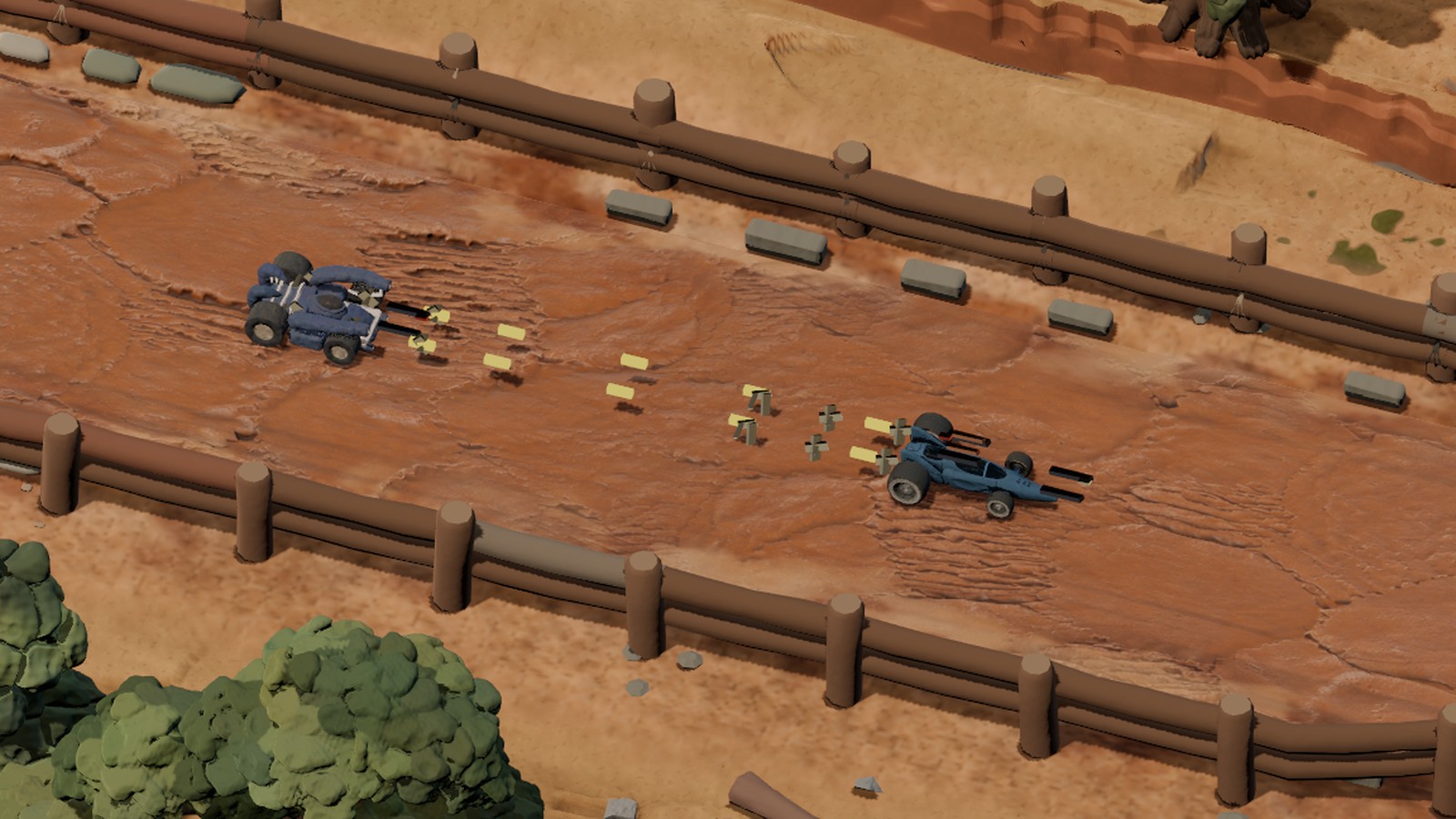 Pincer, a chunky blue combat car, fires two rows of yellow tracer rounds from its twin front guns at Dart, a low open-wheeled racer ahead of it on a fenced dirt straight. Debris flies off Dart's tail where the rounds hit.